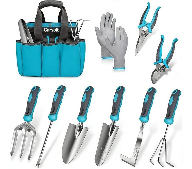 A variety of ergonomic gardening hand tools arranged on a wooden potting bench.