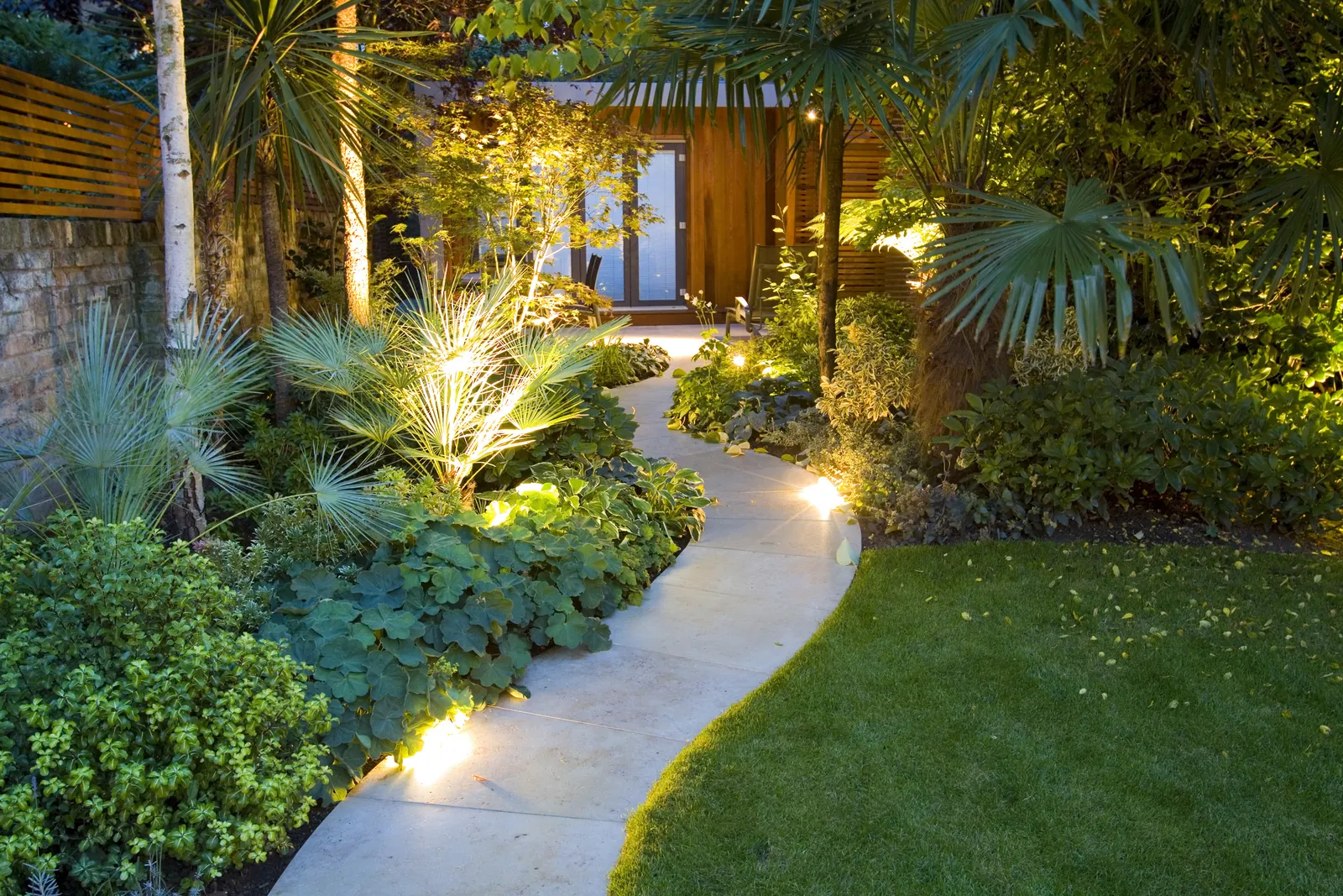 People of different abilities enjoy gardening together in an accessible outdoor space.